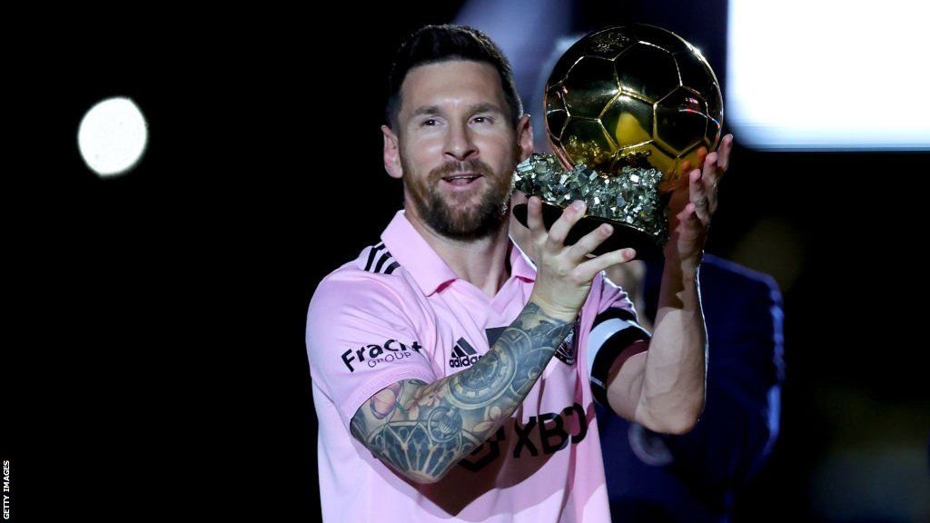 Lionel Messi holds the Ballon d'Or