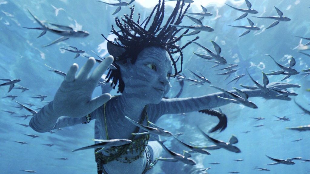 A blue CGI character from Avatar underwater. He is surrounded by fish. Everything looks hyper-realistic.