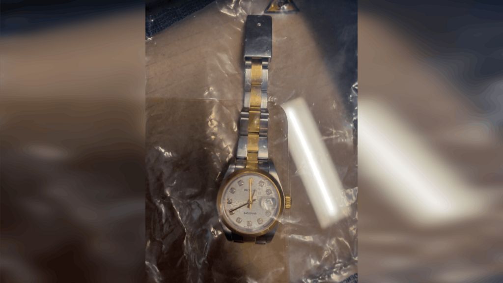 A Rolex watch on a plastic bag.