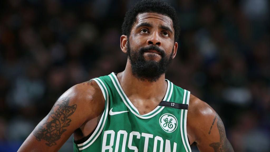 Kyrie Irving looks disgruntled in a Boston jersey