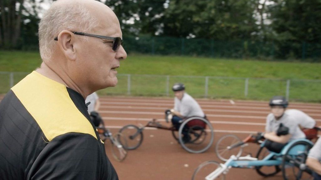 Para athletics coach Rick Hoskins preparing a group to try wheelchair racing before the Great North Run