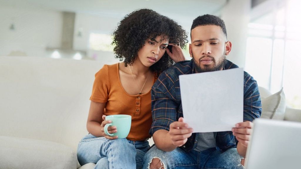 Image of couple looking at bill