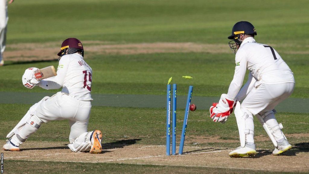 Lewis McManus is bowled by Lancs spinner Tom Hartley to wrap up the Northants innings