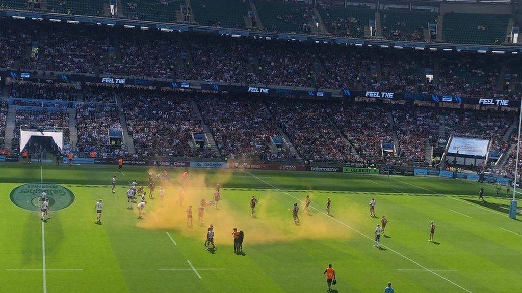 Image showing orange powder spreading across air above the pitch