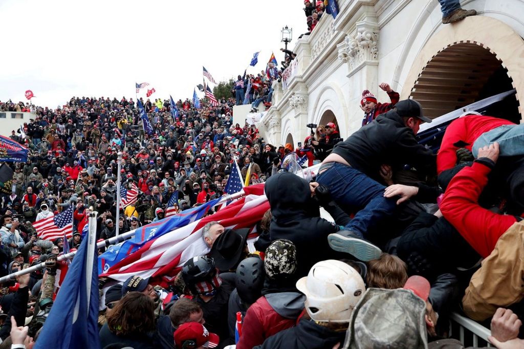 An exterior view of the Capitol riot showing protesters storming the building