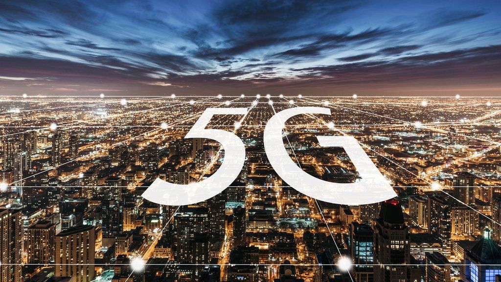 A stock image of a 5G logo over a big city