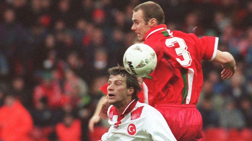 Rob Page (right) challenges Tugay of Turkey in 1996