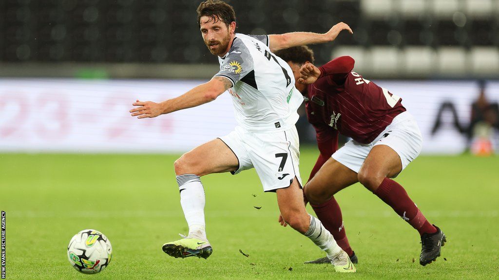 Joe Allen in action in the Carabao Cup against Northampton Town earlier this month
