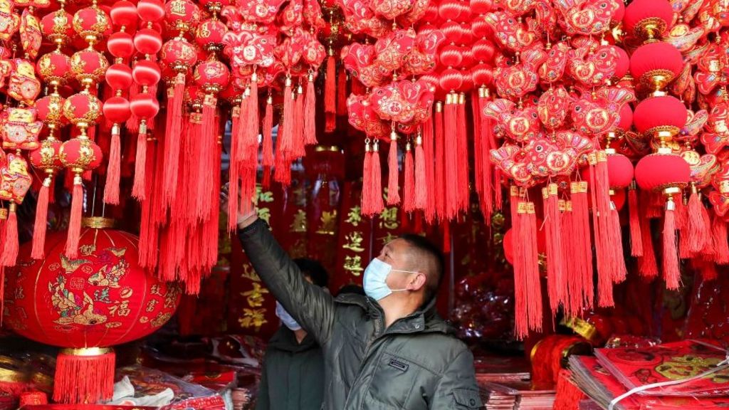 Chinese New Year: Clamping down on going home for the holidays - BBC News