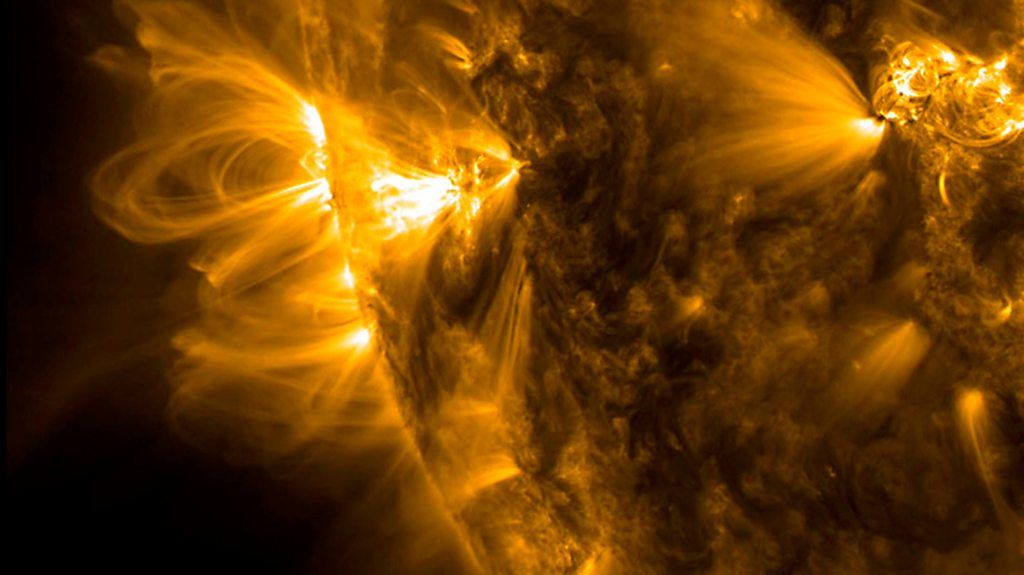 Coronal loops arching over the sun's surface.