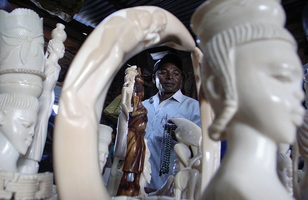 An ivory salesman in Goma, D R Congo, with carvings made of elephant and hippo ivory in 2006