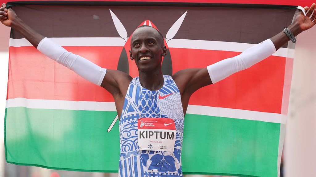 Kelvin Kiptum celebrates after winning the Chicago Marathon in October 2023