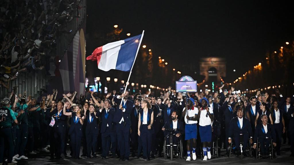 France's delegation arrived at the Place de la Concorde to a huge ovation