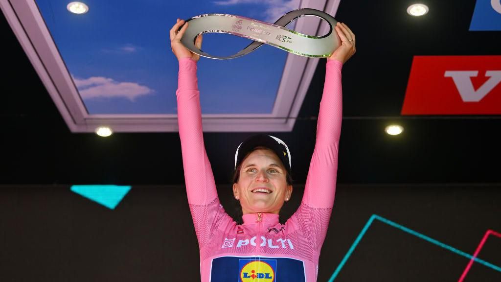 Elisa Longo Borghini lifts the trophy after winning the 2024 Giro d'Italia