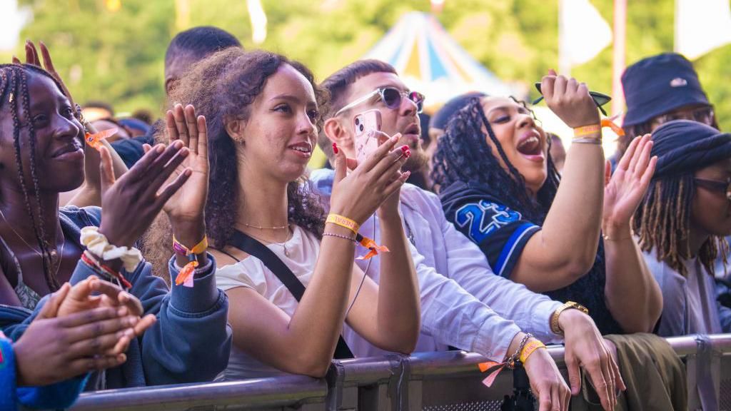 Festival goers at Gunnersbury Park on 6 July 2024