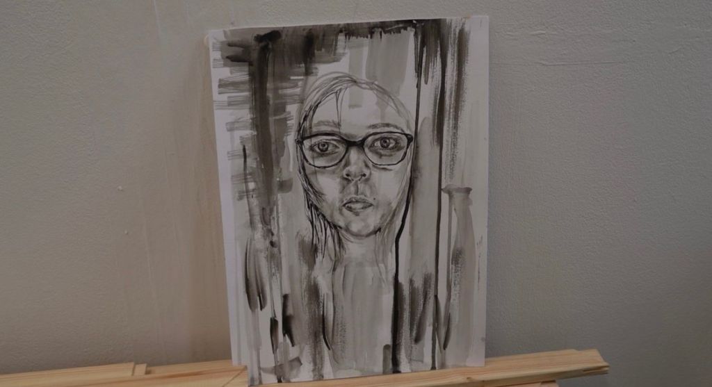 Drawing of a woman with glasses 
