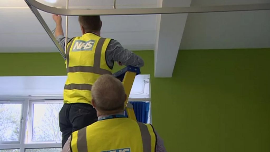 NHS workers inspecting RAAC in a building