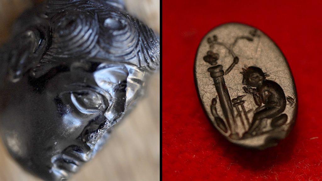A split picture showing a  bronze bust on the left  and a small oval bronze coloured gem with a picture engraved in to it sitting on ared cloth 