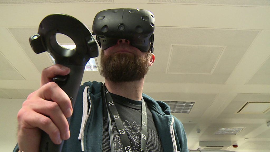 Improbable employee wearing virtual reality set