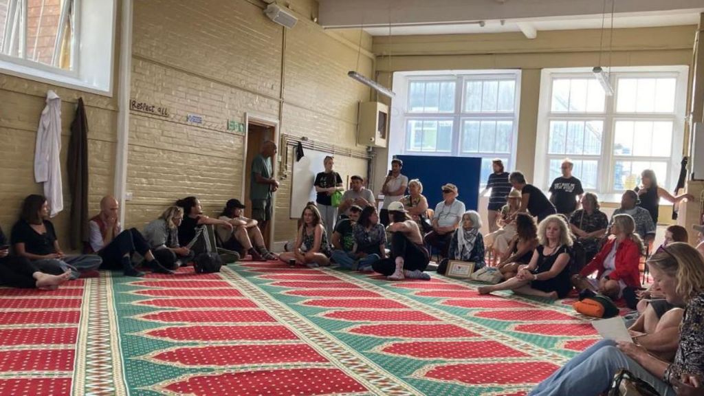 Demonstrators inside Hastings Mosque on Sunday