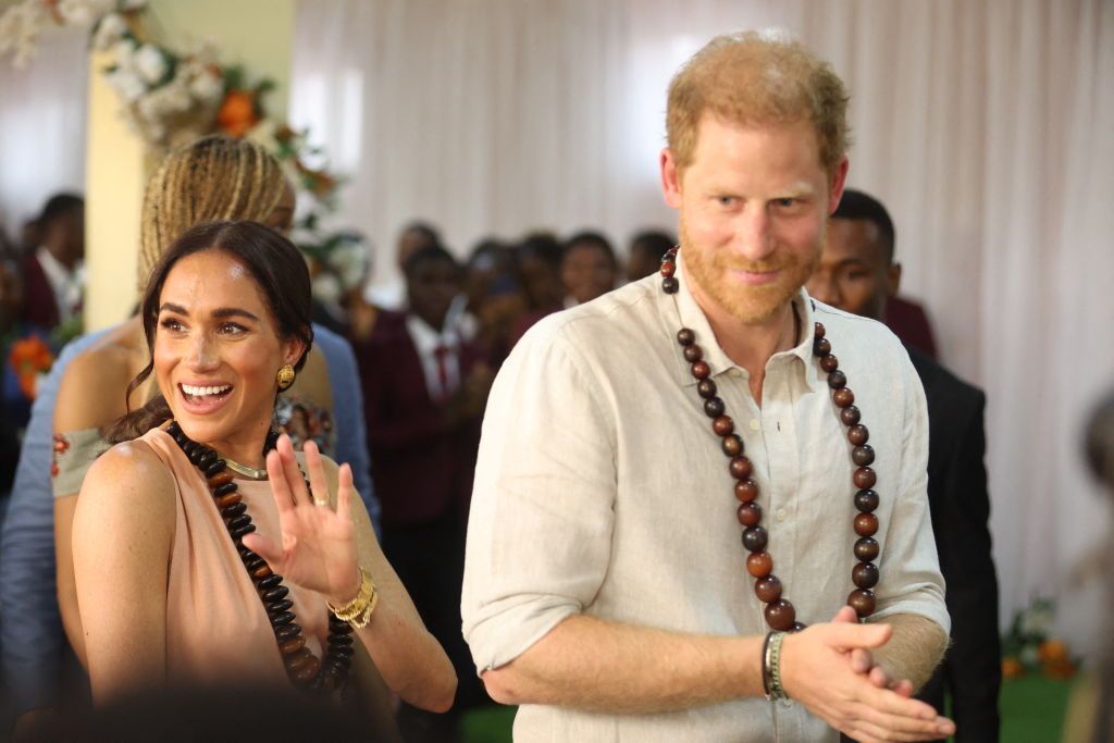 Prince Harry and Meghan at a mental health awareness event at a school in Abuja.