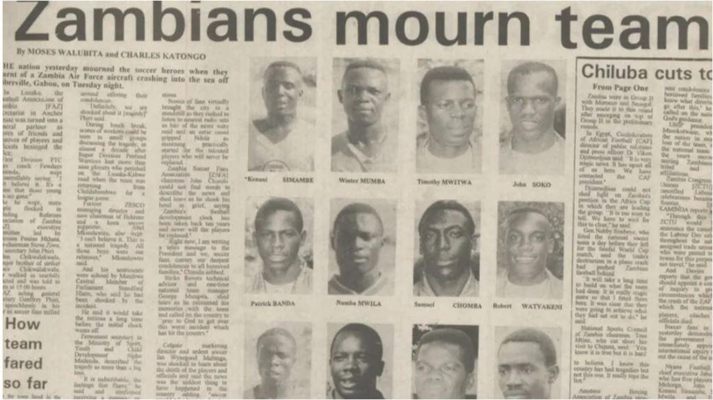 A newspaper article with the headline 'Zambians mourn team' describes the air crash that killed 18 of the nation's footballers 