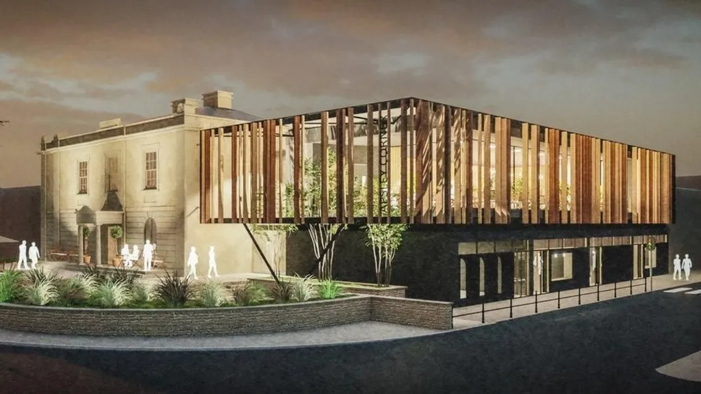 A computer generated impression of what the finished development would look like. The historic rectangular, Georgian style house is on the left, surrounding by paving and landscaping. There is a modern extension attached to the right of the building, with a metal-clad overhang and dark solid base. 