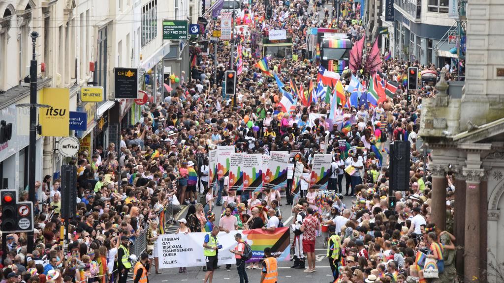 Crowds walking through Brighton on Pride