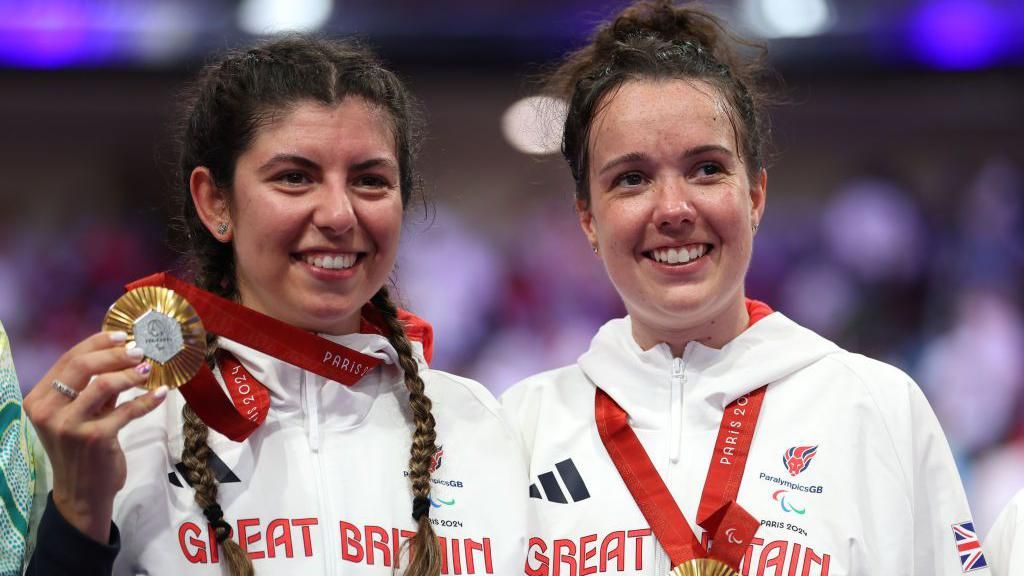 Elizabeth Jordan (right) with her gold medal