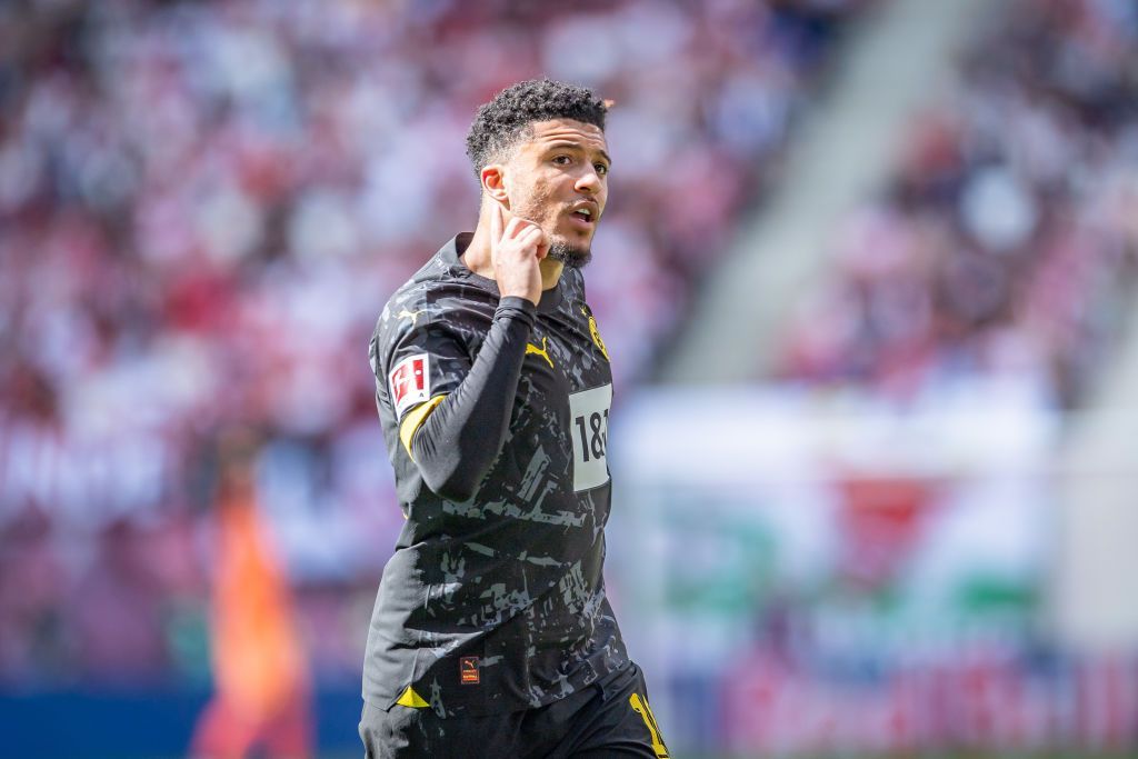 Jadon Sancho celebrates his extremity v RB Leipzig by pointing to his ear