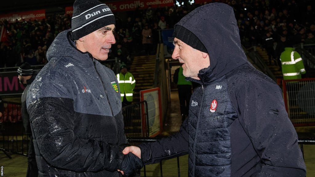 Jim McGuinness congratulates Mickey Harte after Derry's Dr McKenna Cup final win over Donegal in January