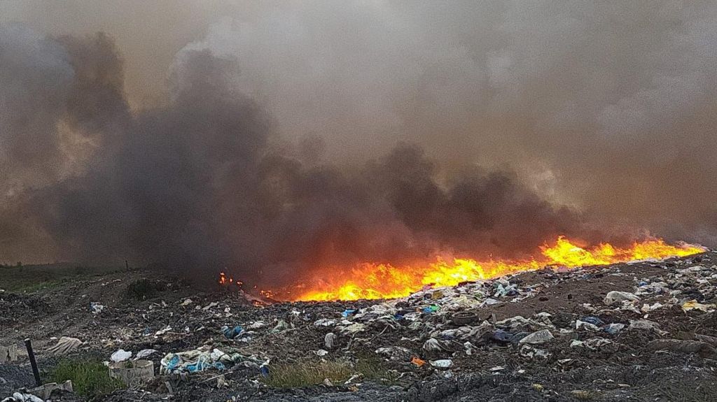 Flames rising from burning rubbish at a recycling centre in Calne, Wiltshire