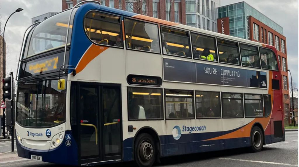A Stagecoach bus waits at traffic lights