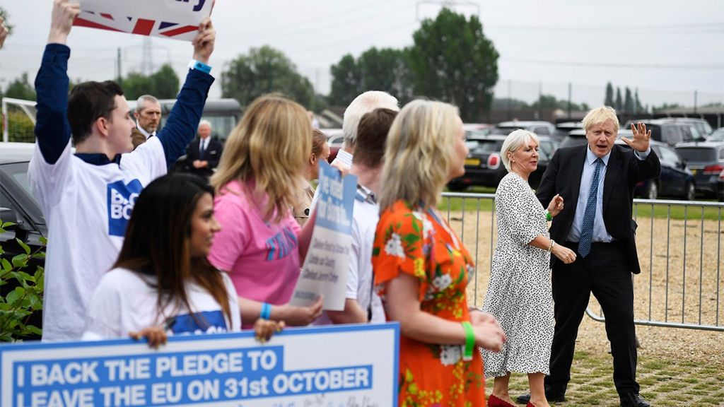 Boris Johnson greets Nadine Dorries and supporters before the Conservative leadership hustings, Wyboston 2019