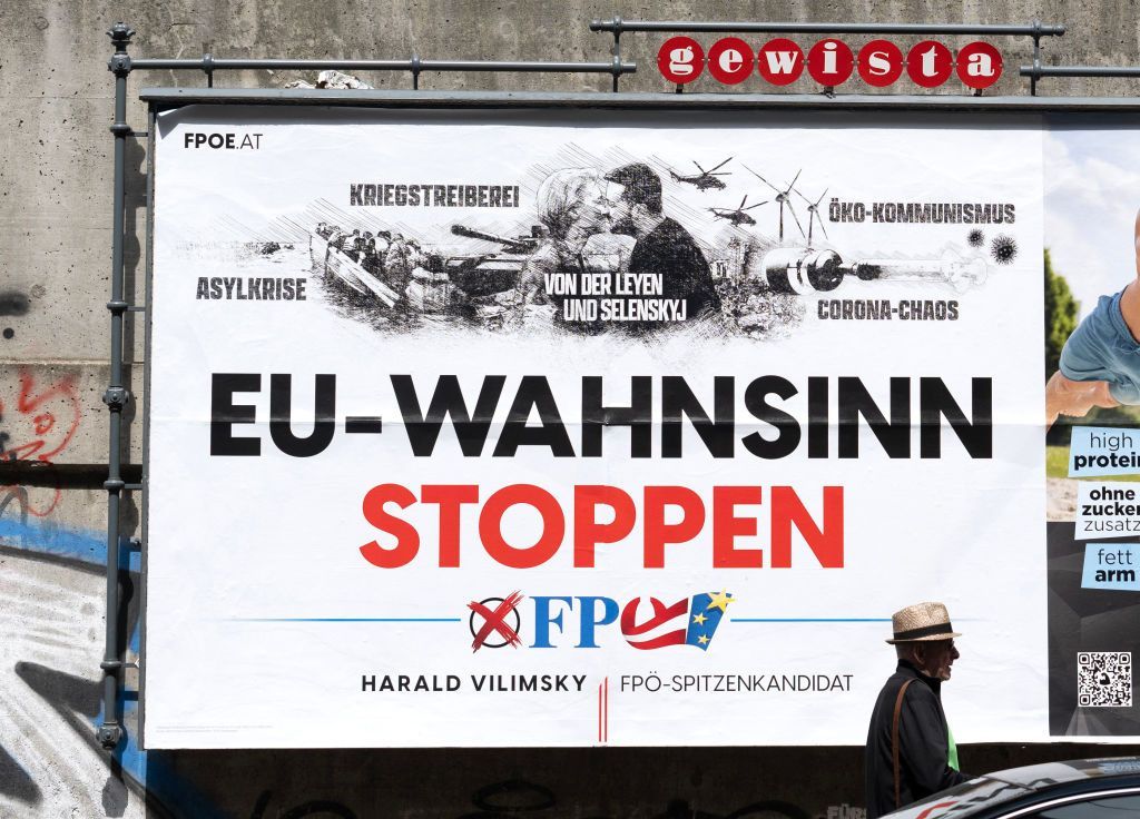 A pedestrian walks past a billboard with an election poster for Harald Vilimsky, top candidate of national-conservative and right-wing Freedom Party of Austria FPO