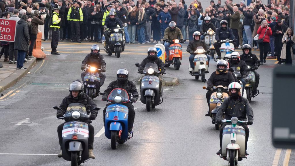 Fans on scooters lead the cortege following the funeral service of former Stone Roses and Primal Scream bass player Gary Mounfield, who was known as Mani, at Manchester Cathedral, following his death at the age of 63.