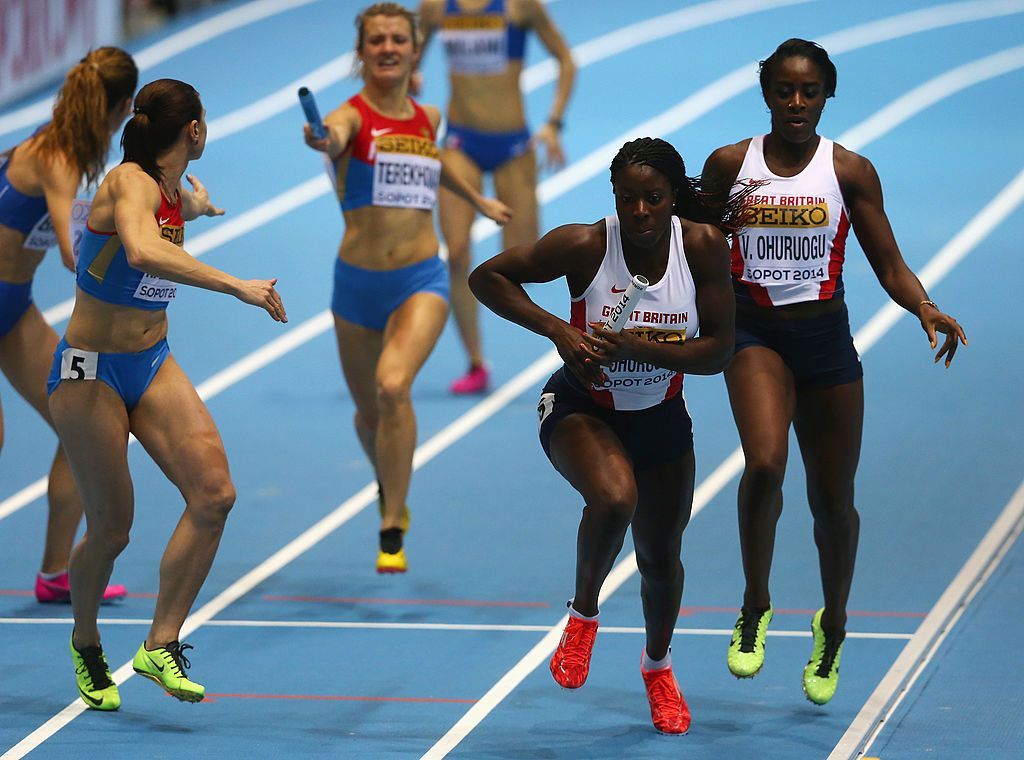 Christine Ohuruogu picks up the baton from sister Victoria at the 2014 World Indoor Championships in Sopot, Poland