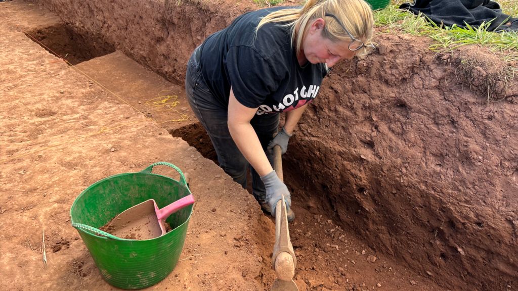 Woman digging on the site