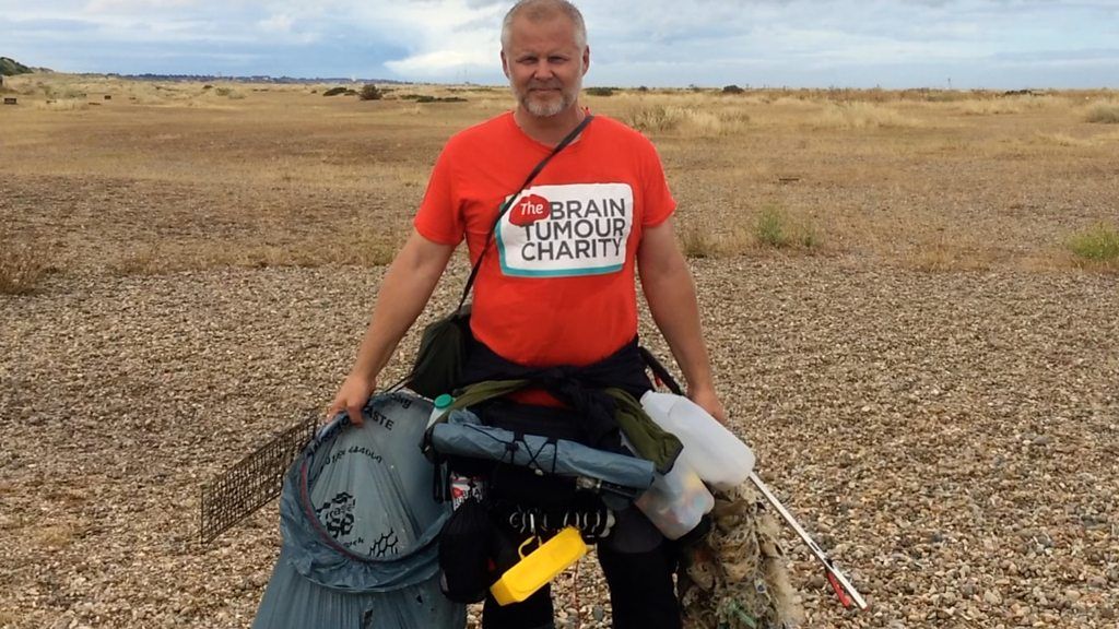 Jason Alexander collecting litter on Suffolk beaches