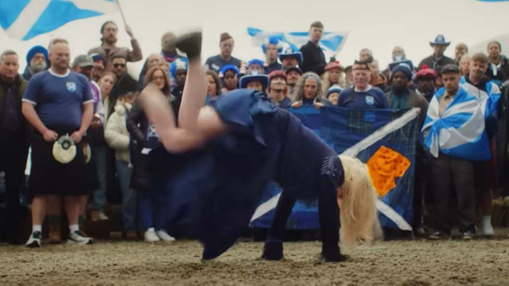 Scotland fans, aka the Tartan Army, with Susan Boyle breakdancing in front of them