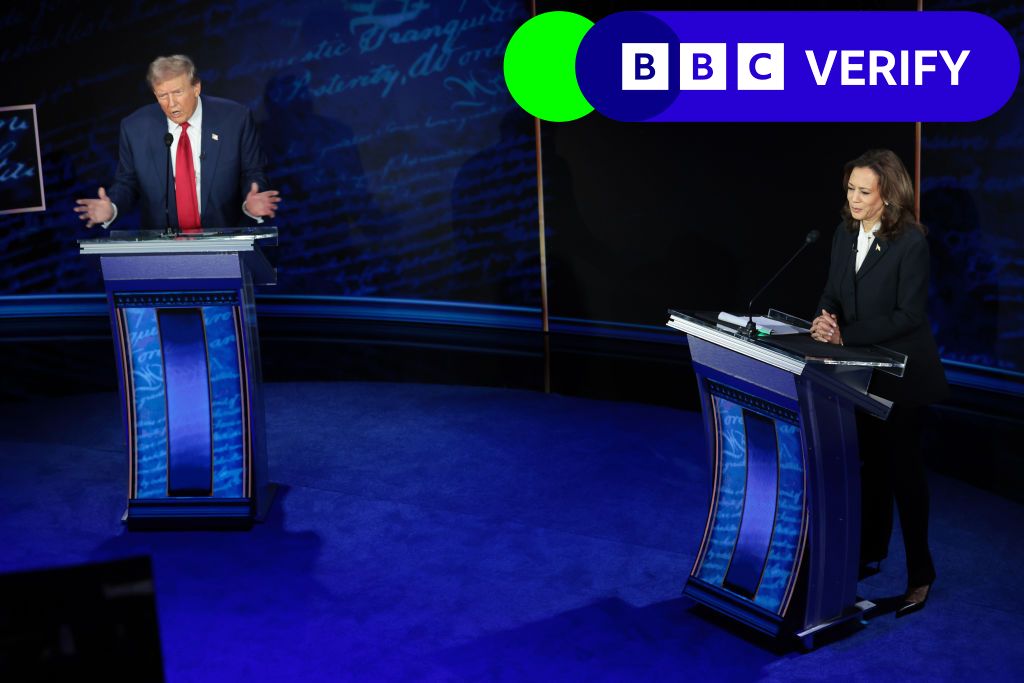 Kamala Harris and Donald Trump stand at their podiums during the ABC News presidential debate.