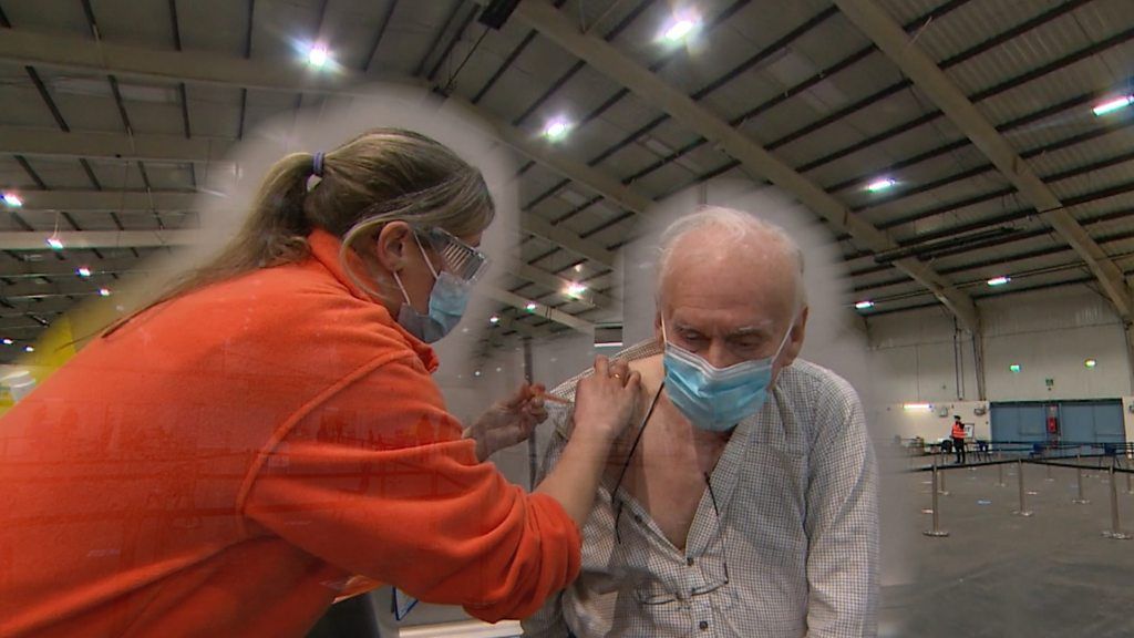 90-year-old Ken got vaccinated at a mass vaccination centre