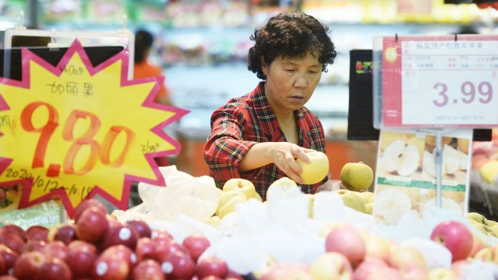 A woman shopping in a supermarket in China.