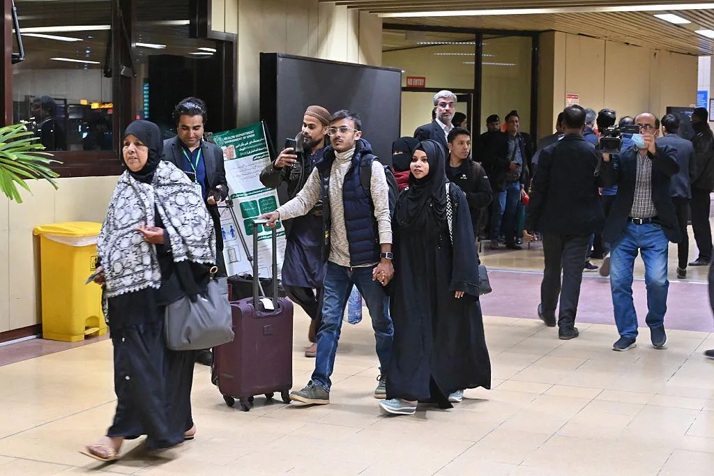 Passengers from Dhaka arrive at Jinnah International Airport in Karachi on January 30, 2026. Direct flights between Bangladesh and Pakistan resumed after more than a decade, as ties warm between the two nations that have long had an uneasy relationship. (Photo by Asif HASSAN / AFP via Getty Images)