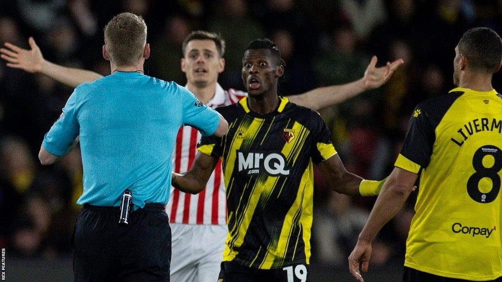Watford's Vakoun Bayo is shown a red card
