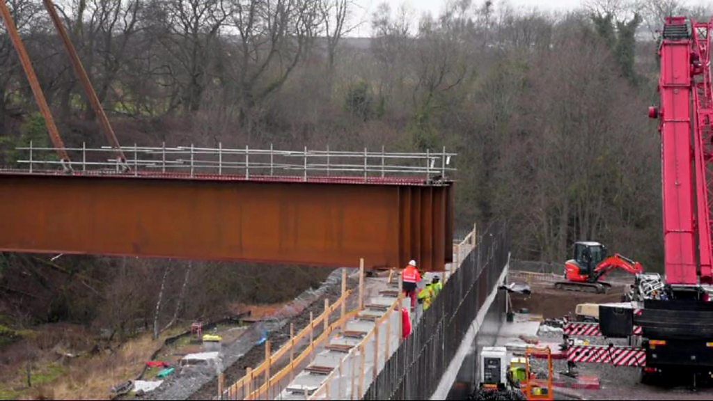 New M8 bridge lifted into place near Bellshill - BBC News