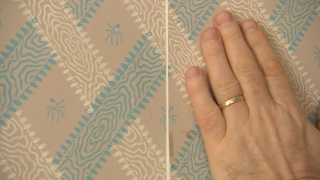 Replica wallpaper being hung in Jane Austen's former house