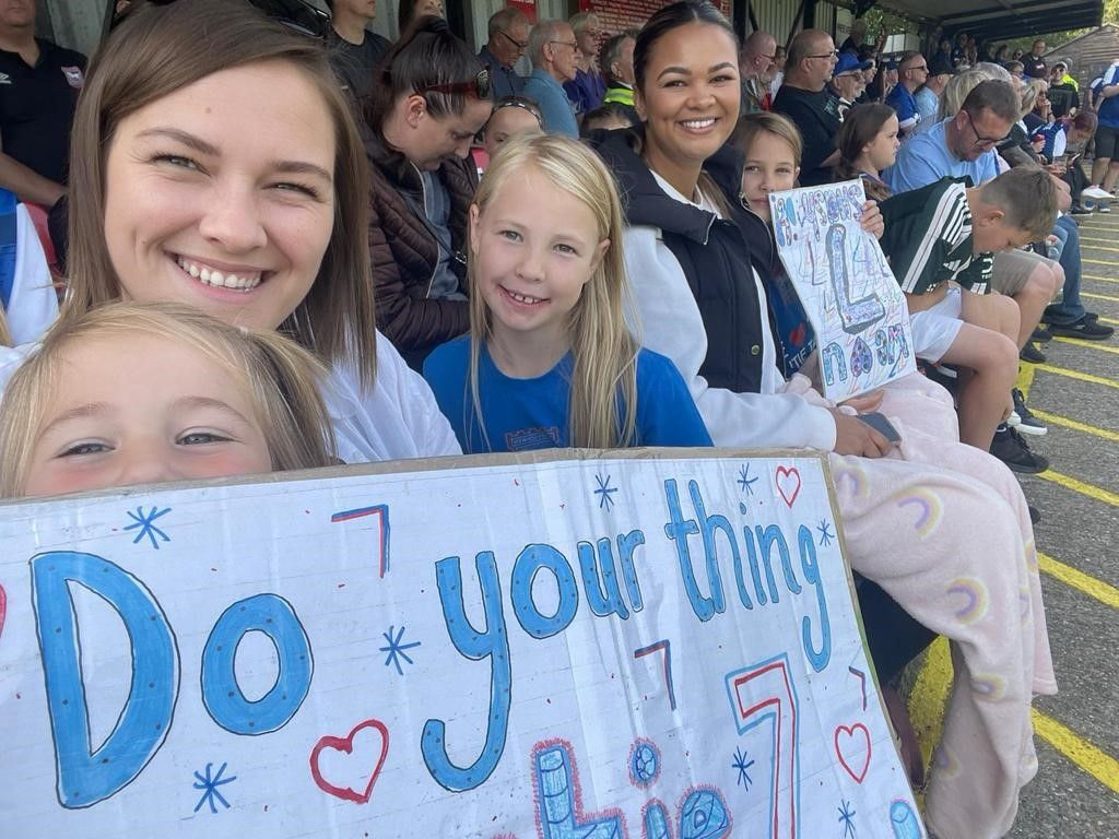 Natasha Thomas' family supporting her at the AGL Arena in Felixstowe, holding up their sign