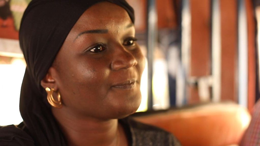 Senegalese woman with black headscarf on a bus
