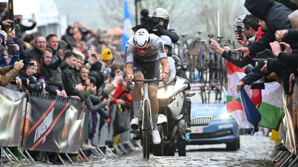 Mathieu van der Poel accelerates up a cobbled climb in the Tour of Flanders